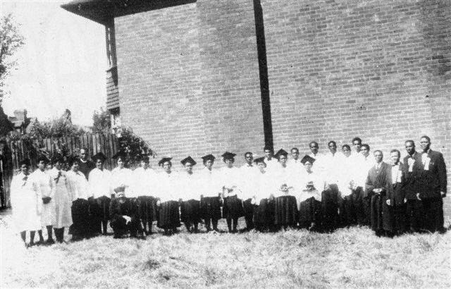 A congregation outside Gibson Road
