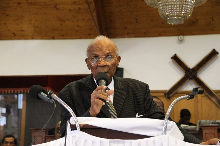 Bishop Dunn speaking into a microphone