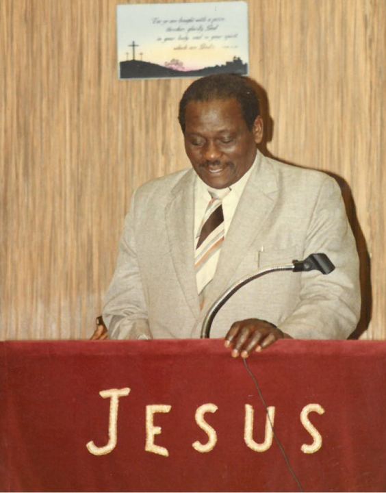 Bishop Arnold George Miller at a pulpit