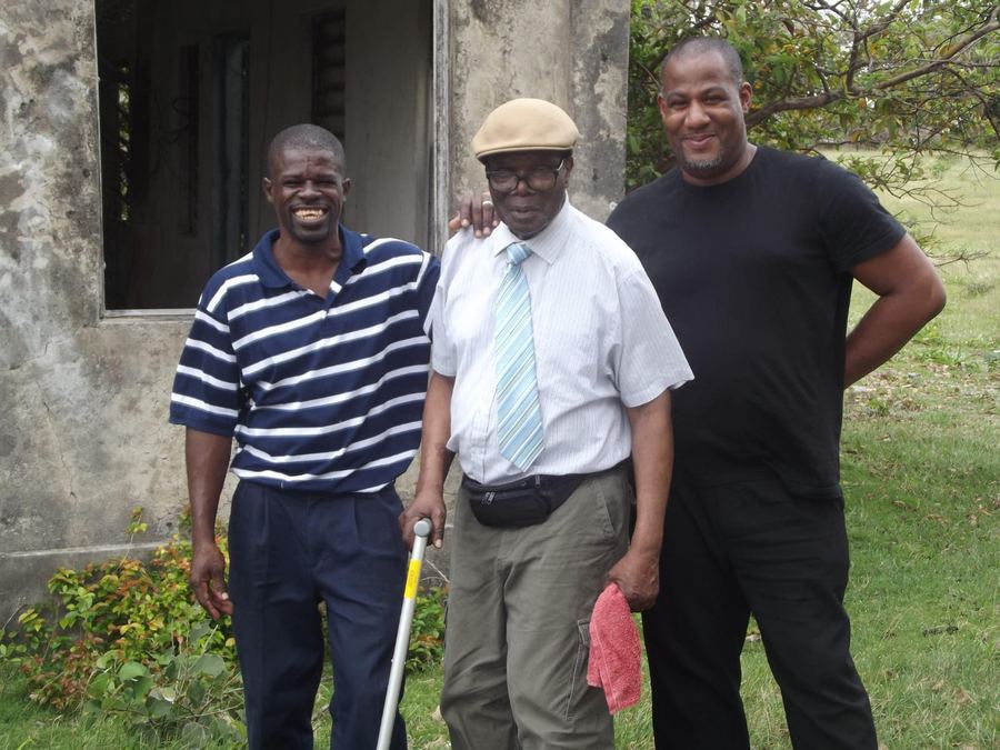 Three men standing outside in Nevis